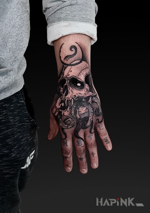 Tattoo Skull with tentacles in skulls motif and graphic / illustrative style On the arm