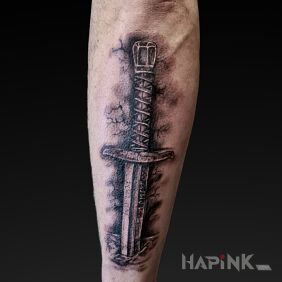 Tattoo Pierced Sword on the forearm motif: fantasy style: realistic