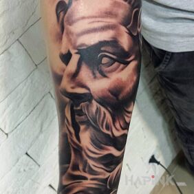 Tattoo Poseidon on the forearm style: realistic