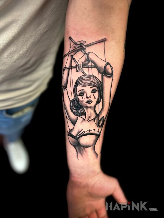 Tattoo Puppet in characters motif and graphic / illustrative style On the arm