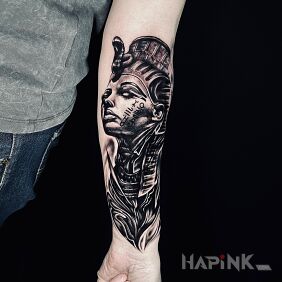 Tattoo Nefertiti on the forearm motif: black and gray style: realistic