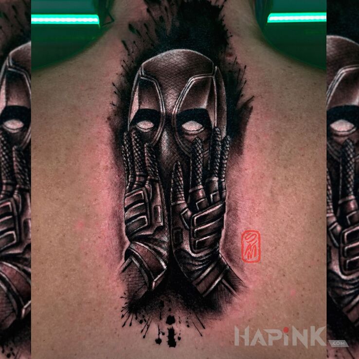 Tattoo Deadpool in funny motif and realistic style on the back
