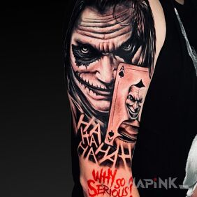 Tattoo Joker on the upper arm motif: faces style: realistic