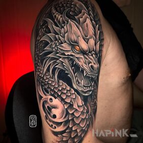 Tattoo Dragon on the shoulder motif: black and gray style: realistic