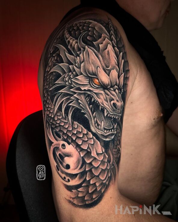 Tattoo Dragon in dragons motif and realistic style on the upper arm