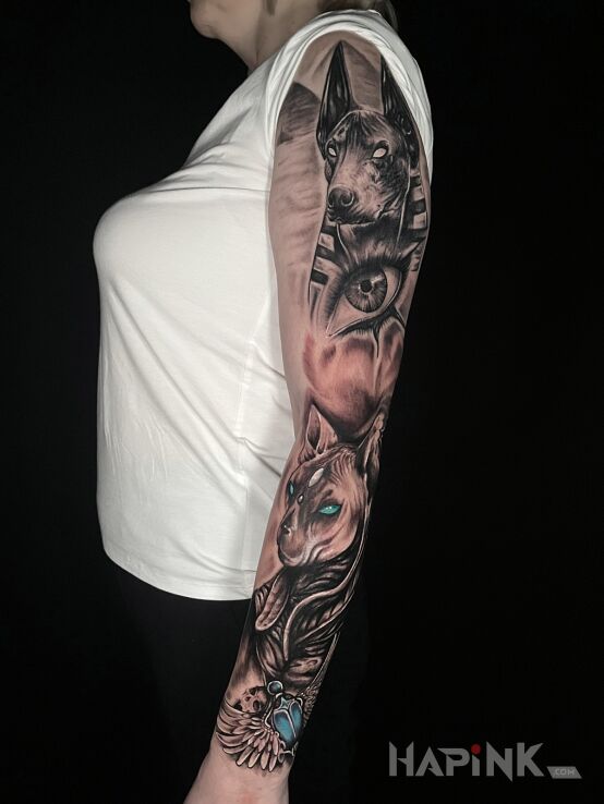Tattoo Egyptian sleeve in sleeves motif and realistic style on the upper arm