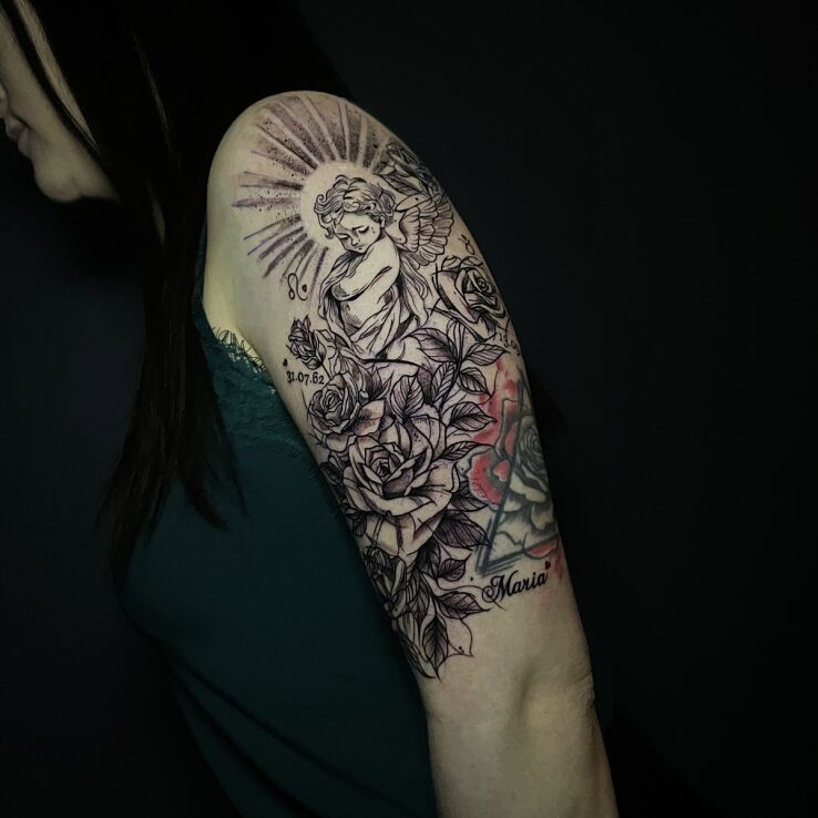 Tattoo Little angel rays and roses fitted into an old tattoo in black and gray motif and sketch style On the arm