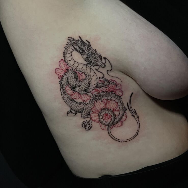 Tattoo Dragon with Flowers in flowers motif and graphic / illustrative style on the ribs