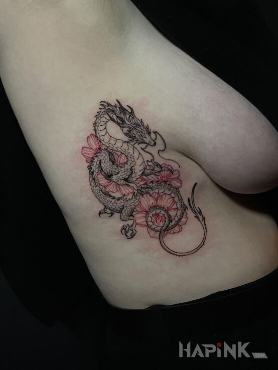 Tattoo Dragon with Flowers in black and gray motif and graphic / illustrative style on the ribs