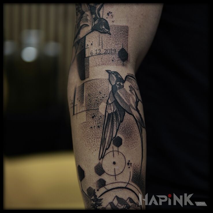 Tattoo Sleeve in symbolism in lettering motif and dotwork style on the upper arm