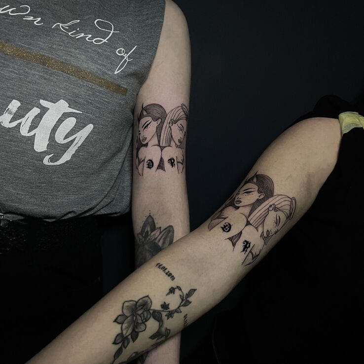 Tattoo Matching devil girl and angel girl in Love motif and contour / linework style on the bicep