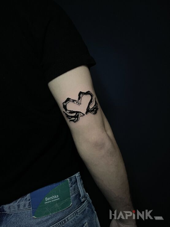 Tattoo Swan Heart in abstract style On the arm