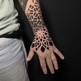 Tattoo Mandala geometry On the arm motif: black and gray style: geometric