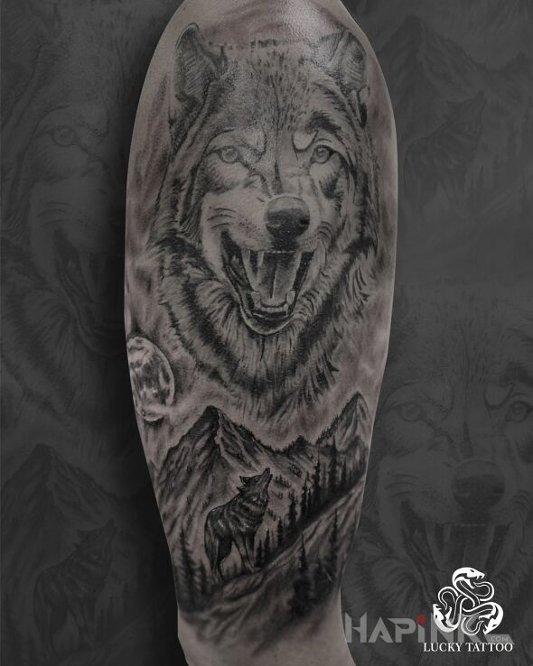 Tattoo Wolf as a symbol of independence and wild nature 🐺 in black and gray motif and realistic style On the arm