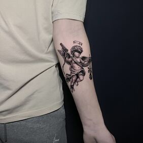 Tattoo Little Angel with a Gun and a Rose On the arm motif: angels style: graphic / illustrative