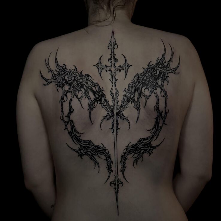 Tattoo Cybersigilism in the shape of a heart in ornaments motif on the back