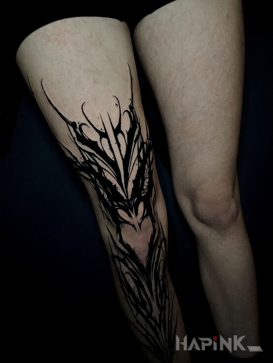 Tattoo Dark ornamental dark ornament in black and gray motif and blackwork / blackout style on the tibia
