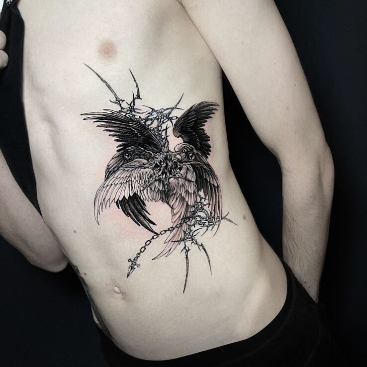 Tattoo Seraphim against a neotribal background in wings motif and graphic / illustrative style on the ribs