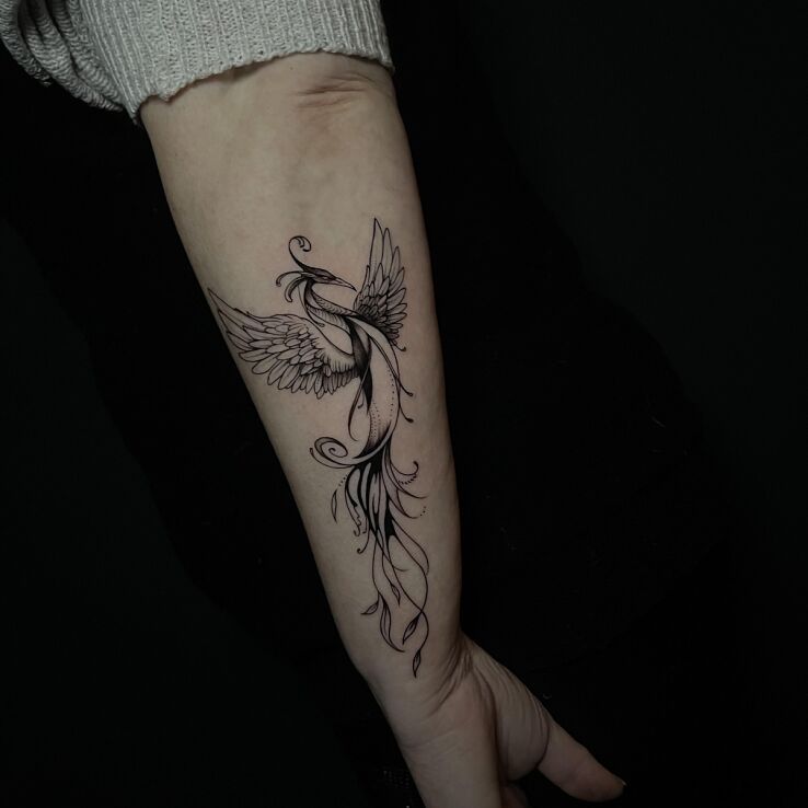 Tattoo Delicate Phoenix in animals motif and graphic / illustrative style on the forearm