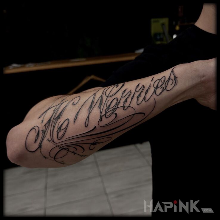 Tattoo No Worries in lettering motif and calligraphy style On the arm