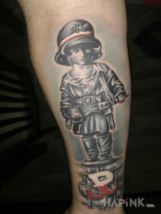 Tattoo Mały powstaniec in patriotic motif on the forearm