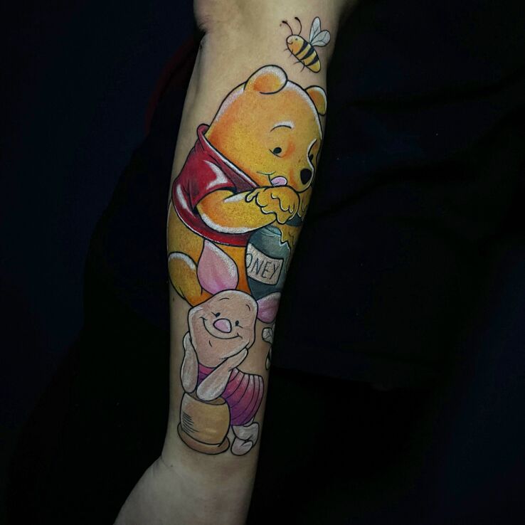 Tattoo Winnie the Pooh and Piglet in colorful motif and graphic / illustrative style On the arm