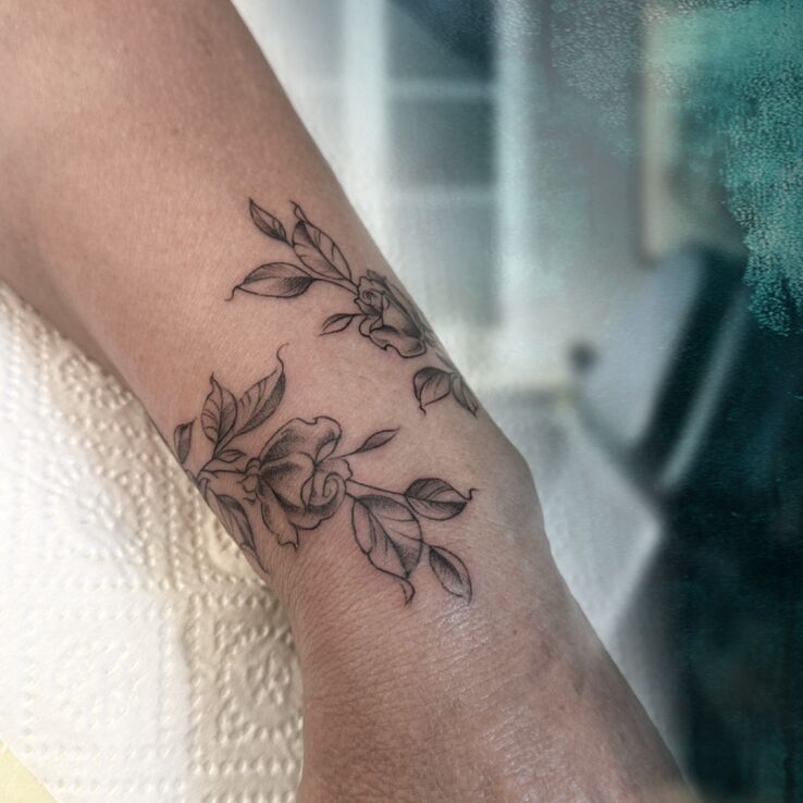 Tattoo ✨🌹 Jewelry That Grows With You 🌹✨ in graphic / illustrative style on the wrist