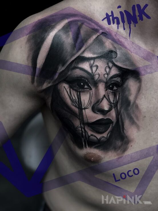 Tattoo Portret in faces motif on the chest