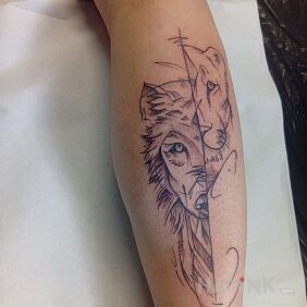 Tattoo Wolf on the leg motif: black and gray style: sketch