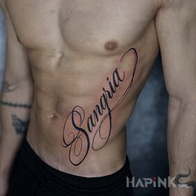 Tattoo Inscription "Samgria" on the stomach motif: lettering style: calligraphy
