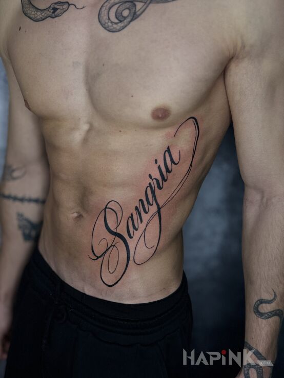 Tattoo Inscription "Samgria" in lettering motif and calligraphy style on the stomach