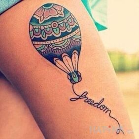 Tattoo Freedom on the leg motif: objects
