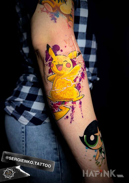 Tattoo Pikachu in color in colorful motif and cartoon / comic book style on the forearm
