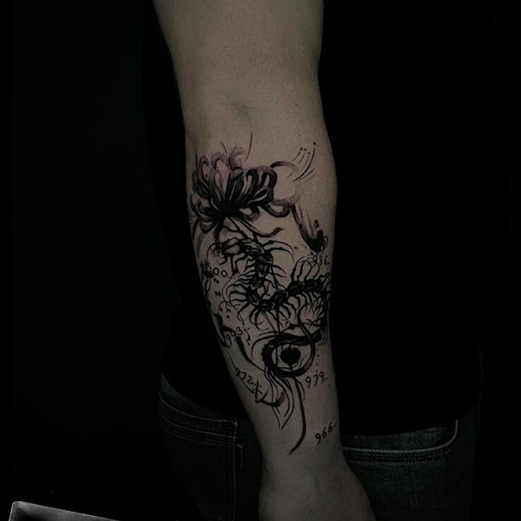 Tattoo Centipede with flower and numbers in floral motif and graphic / illustrative style on the forearm