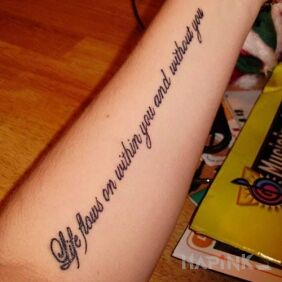 Tattoo Sentence in English on the forearm motif: lettering
