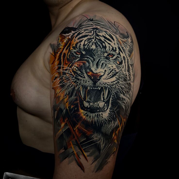 Tattoo Tiger with geometric elements in color in colorful motif and realistic style on the shoulder