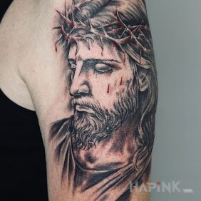 Tattoo Jesus with a bleeding crown of thorns On the arm motif: faces style: realistic