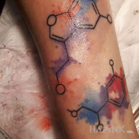 Tattoo Serotonin on the forearm motif: colorful