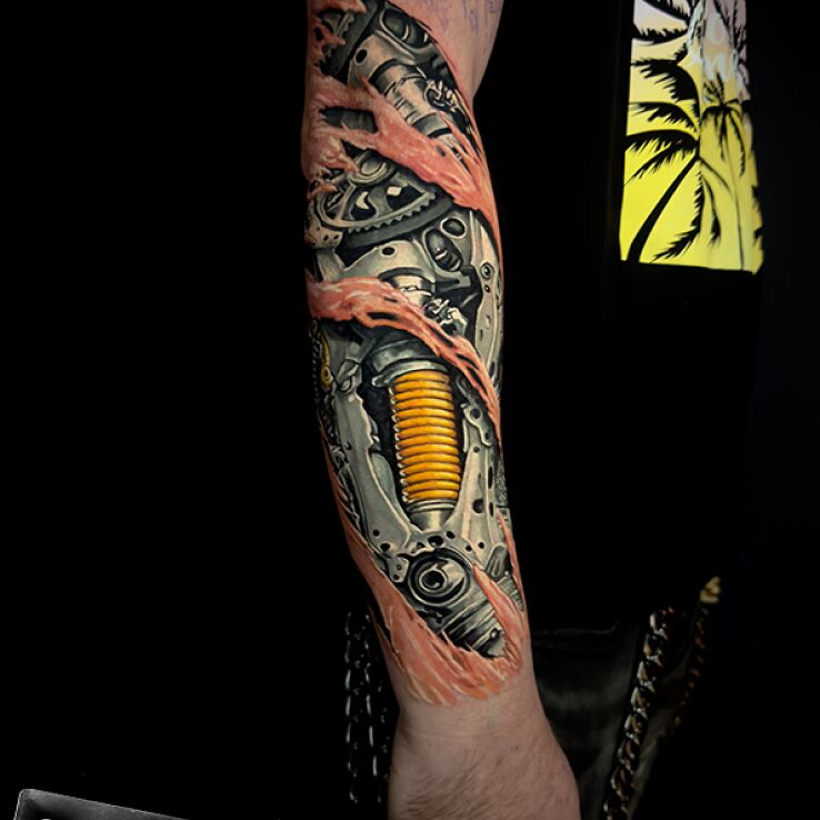Tattoo Biomechanics in Color in 3D motif and biomechanics style on the forearm