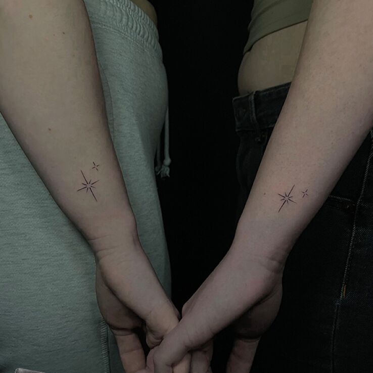 Tattoo Matching stars in black and gray motif and minimalistic style on the forearm