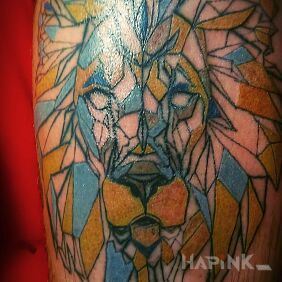 Tattoo Lion on the calf motif: colorful style: geometric
