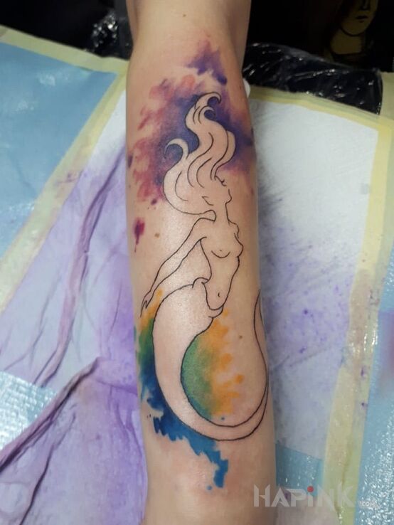 Tattoo Syrenka in colorful motif on the forearm