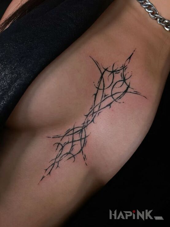Tattoo Tribal-like pattern in other motif on the breast