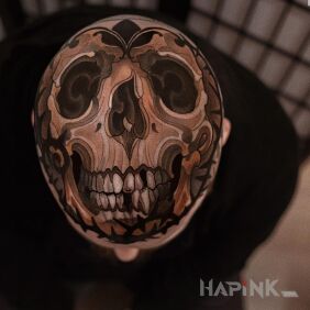 Tattoo Head on a ball not Armani on the head motif: skulls style: neo-traditional