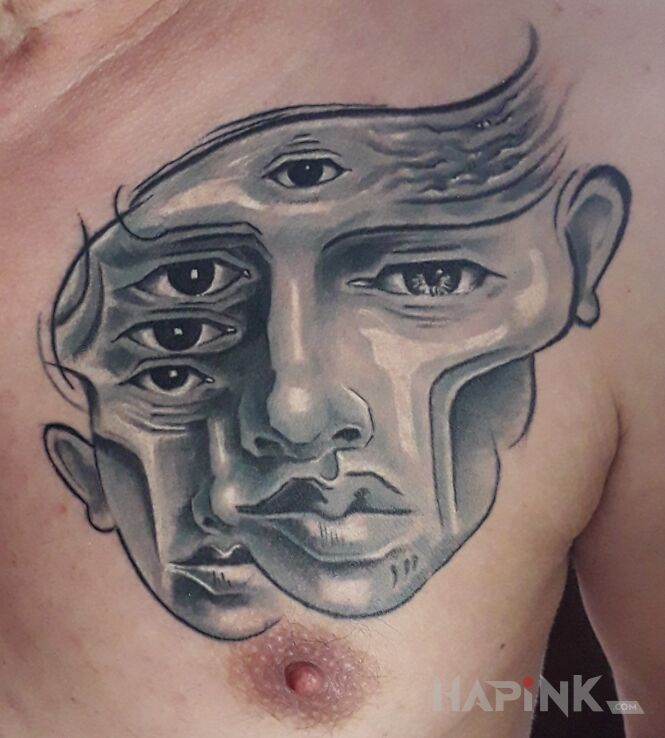 Tattoo Pandemic Pain in faces motif and surrealistic style on the chest
