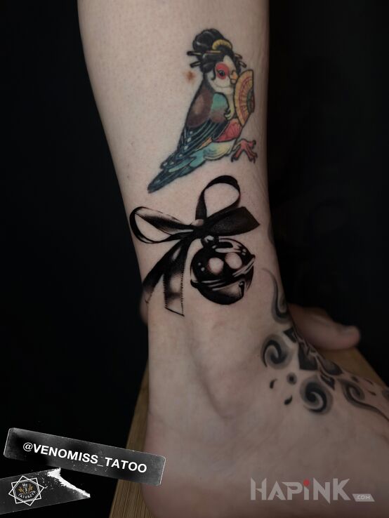 Tattoo Bell with a Bow in 3D motif and realistic style on the leg