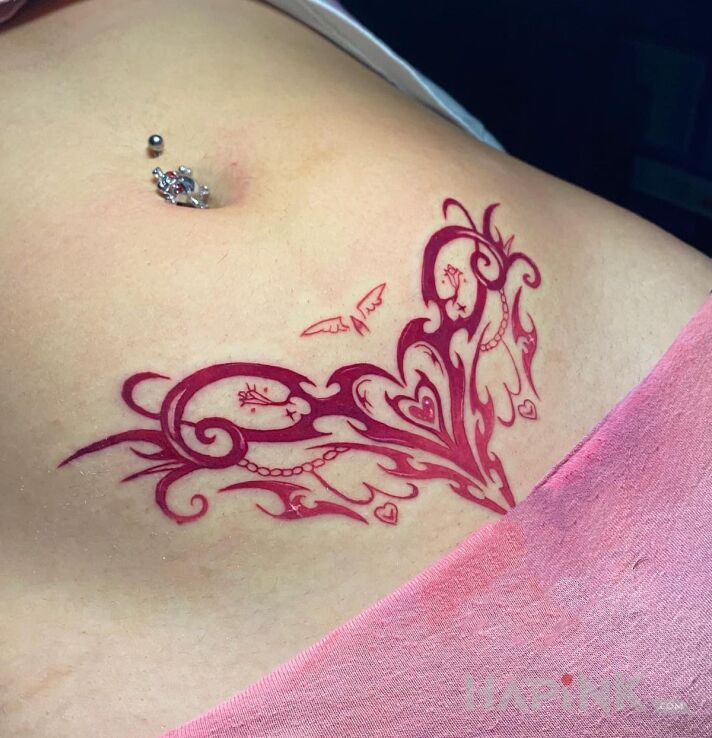Tattoo Pink tribal heart in other motif intimate