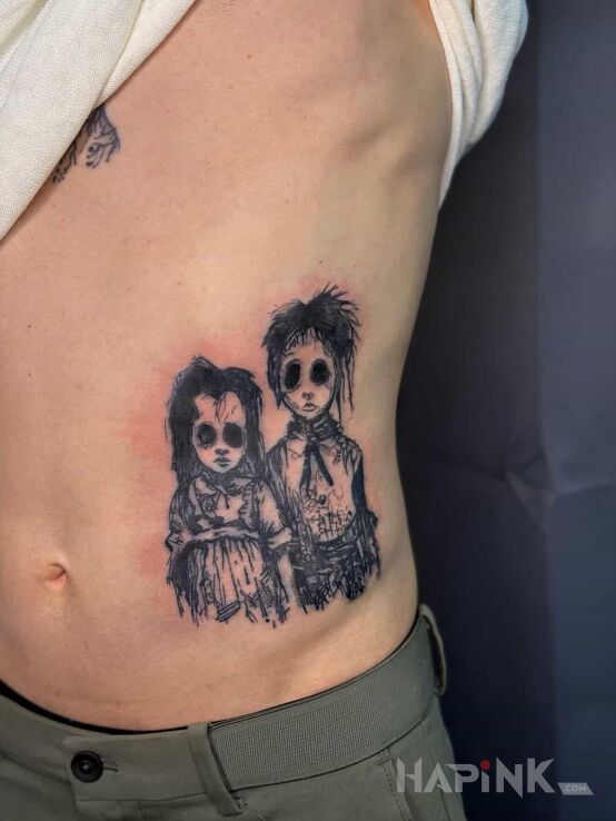 Tattoo Children in black and gray motif and graphic / illustrative style on the ribs