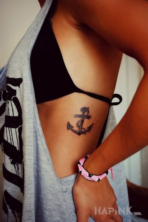Tattoo Kotwica in objects motif on the ribs