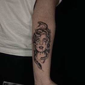 Tattoo Medusa On the arm motif: black and gray style: graphic / illustrative